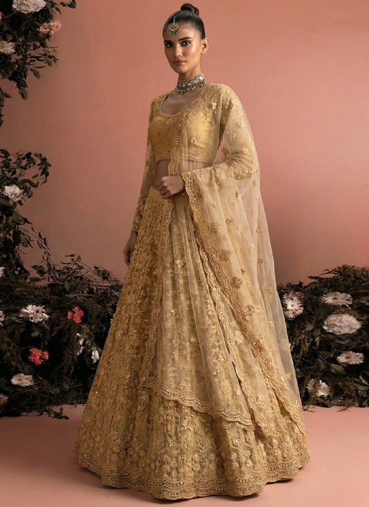Beige Net Heavy Embroidered Wedding Lehenga